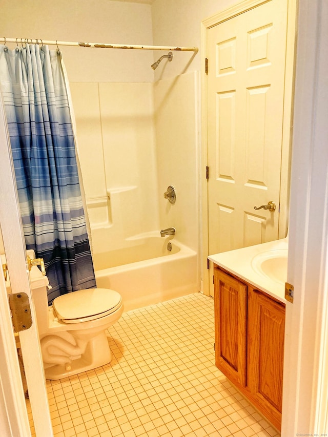 full bathroom featuring shower / bath combo, vanity, tile patterned floors, and toilet