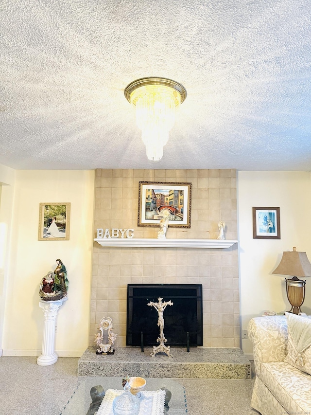 living room featuring a fireplace and a textured ceiling