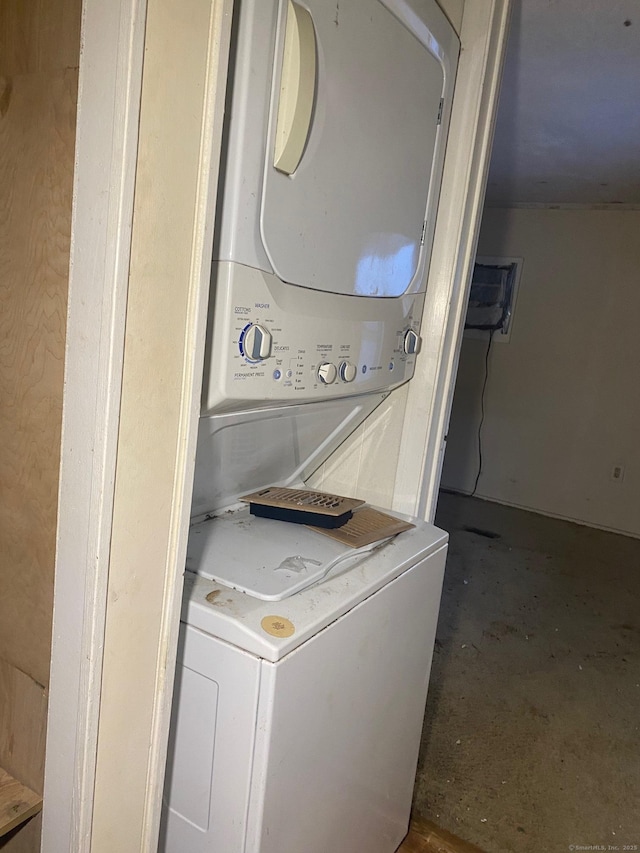 laundry room featuring stacked washer and clothes dryer