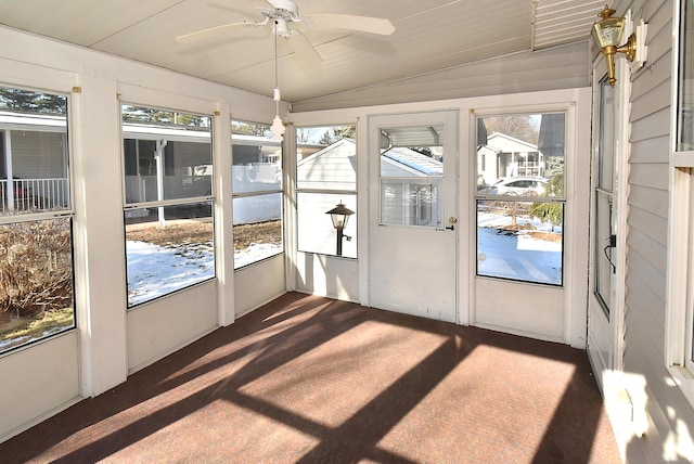 unfurnished sunroom featuring vaulted ceiling and ceiling fan