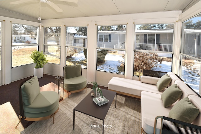 sunroom / solarium with ceiling fan and a healthy amount of sunlight