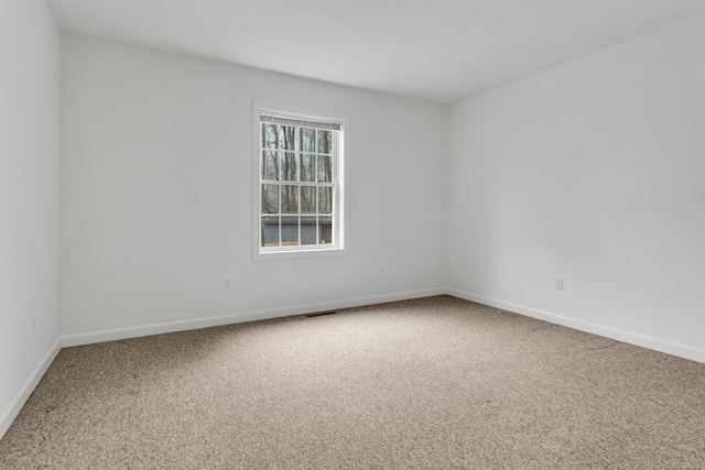 empty room with carpet flooring