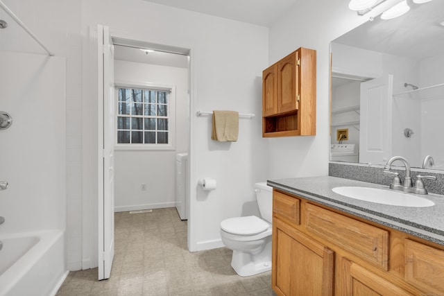 full bathroom with vanity, washer / dryer,  shower combination, and toilet