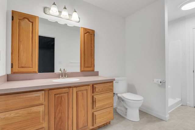 bathroom with vanity, toilet, and a shower