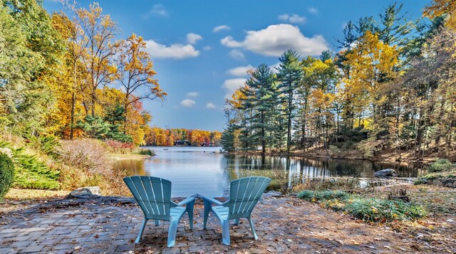 view of patio with a water view