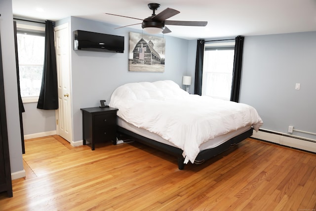 bedroom featuring ceiling fan and light wood-type flooring