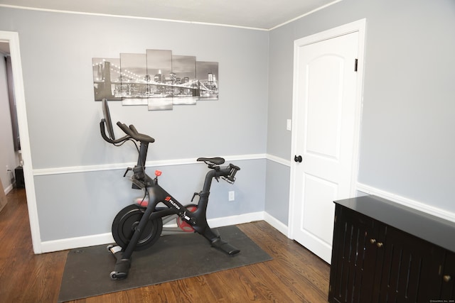 exercise area with dark wood-type flooring