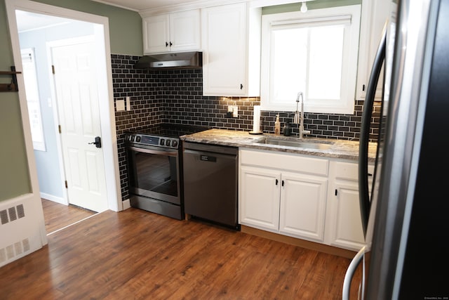 kitchen featuring sink, dark wood-type flooring, black appliances, white cabinets, and light stone countertops