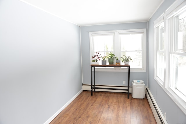 interior space with a baseboard radiator