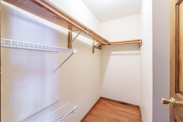 walk in closet featuring light wood-type flooring