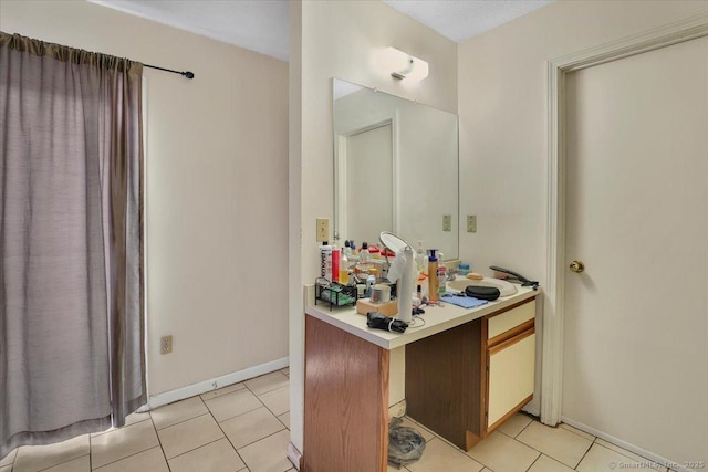 bathroom with tile patterned floors and vanity