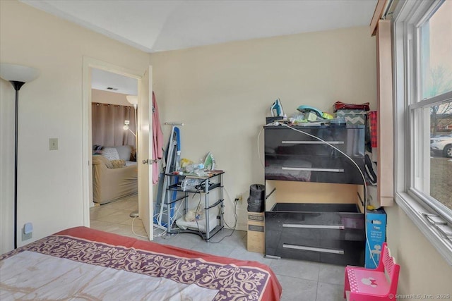 bedroom featuring light tile patterned flooring