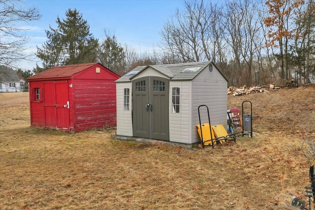 view of outbuilding featuring a yard