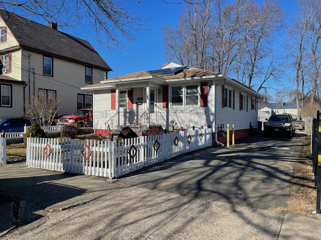 view of front of house with solar panels