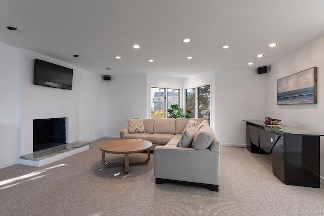 10 Surf Rd, Westport, CT 06880 - living room with recessed lighting, light carpet, baseboards, and a fireplace with raised hearth