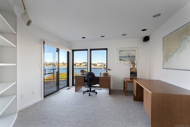 office space featuring a water view