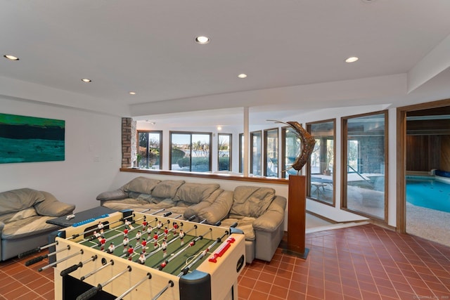 10 Surf Rd, Westport, CT 06880 - living room with recessed lighting and tile patterned floors