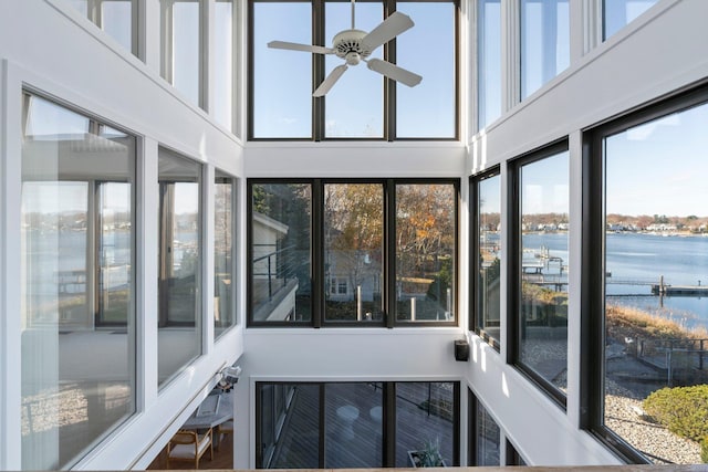 10 Surf Rd, Westport, CT 06880 - unfurnished sunroom with a water view and a high ceiling