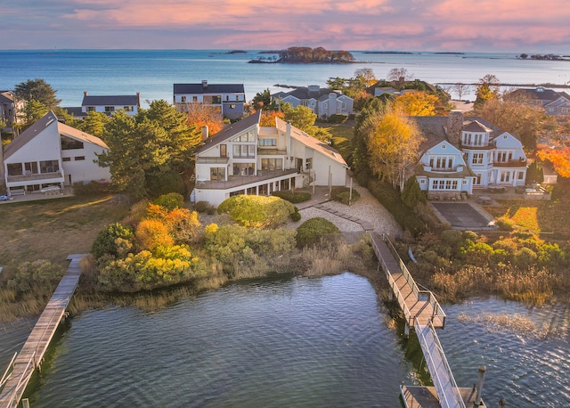 aerial view at dusk with a water view