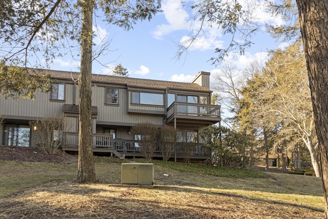 rear view of house with a lawn