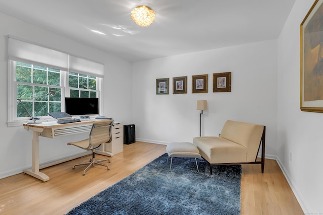 office with baseboards and light wood finished floors