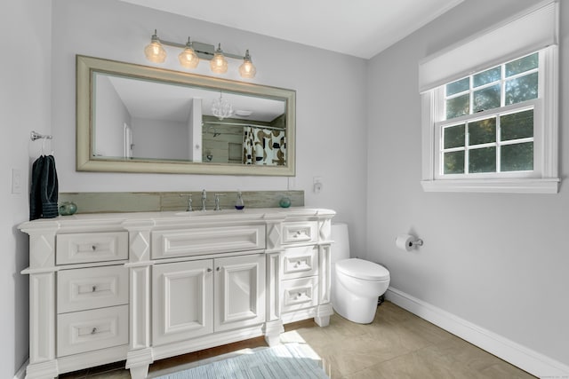 bathroom with vanity, toilet, and walk in shower