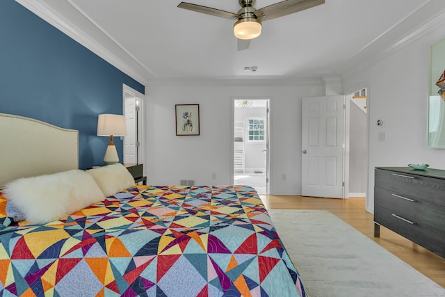 bedroom with light wood finished floors, ceiling fan, visible vents, and ornamental molding