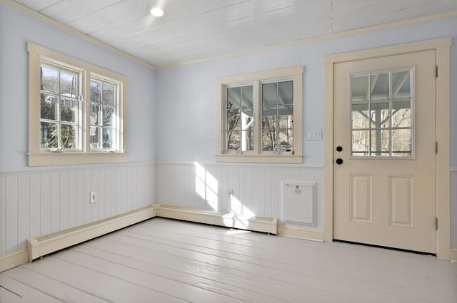 entryway with baseboard heating and light hardwood / wood-style flooring