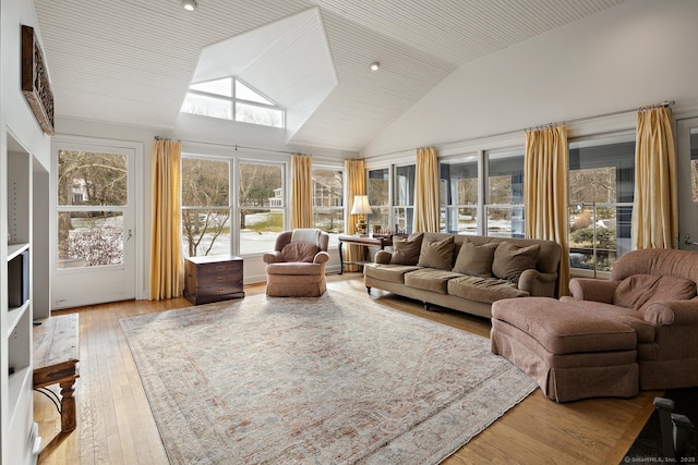 sunroom featuring lofted ceiling