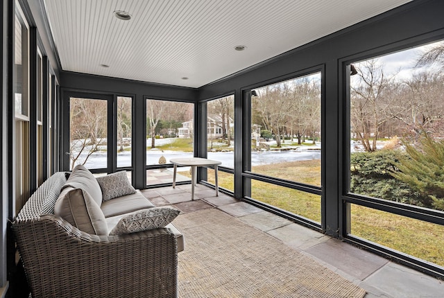 sunroom / solarium with plenty of natural light and wooden ceiling