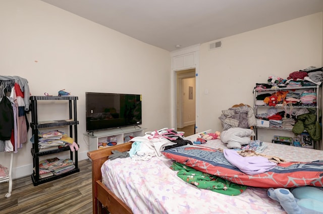 bedroom featuring dark hardwood / wood-style floors