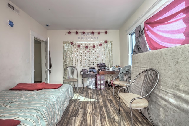 bedroom with wood-type flooring