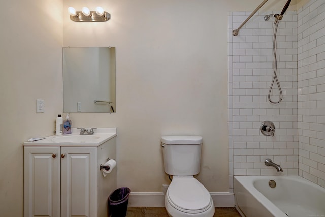 full bathroom with tiled shower / bath, vanity, and toilet