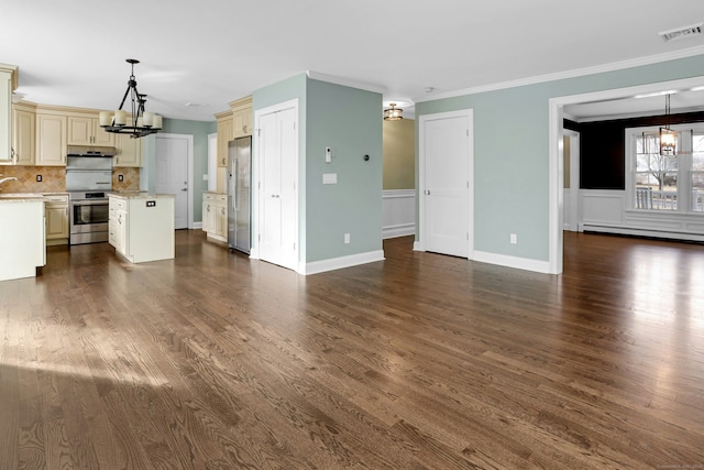 unfurnished living room featuring an inviting chandelier, visible vents, baseboard heating, and dark wood-type flooring