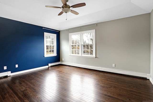 unfurnished room with ceiling fan, wood-type flooring, a baseboard radiator, and baseboards