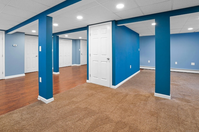 finished below grade area featuring carpet floors, recessed lighting, and baseboards