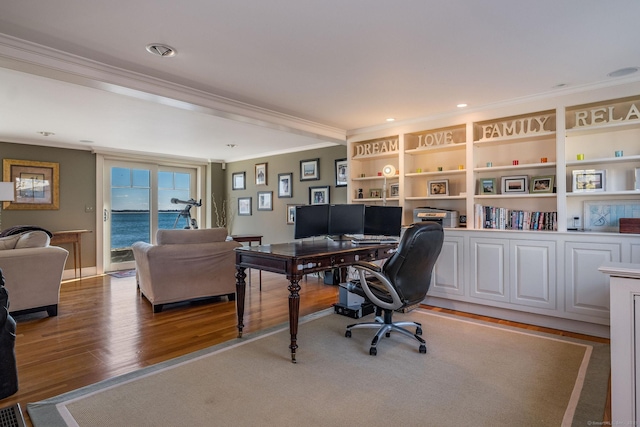 office area featuring hardwood / wood-style flooring and ornamental molding