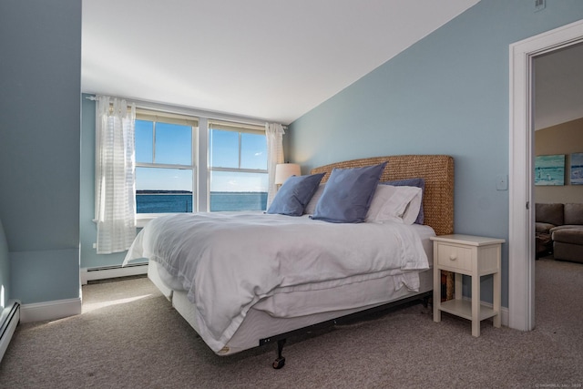 bedroom featuring carpet flooring, baseboard heating, and a water view