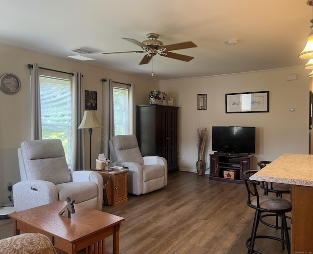 living room featuring dark hardwood / wood-style flooring and ceiling fan