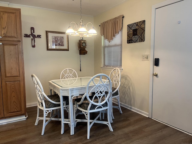 dining room featuring dark hardwood / wood-style flooring and a notable chandelier