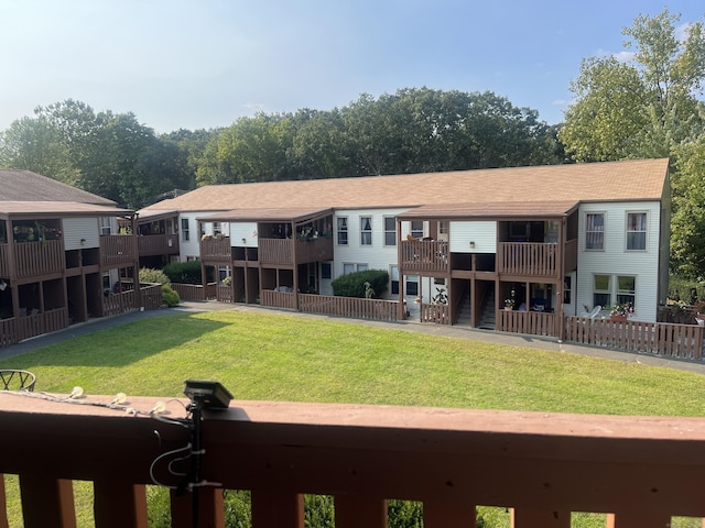 rear view of house featuring a yard