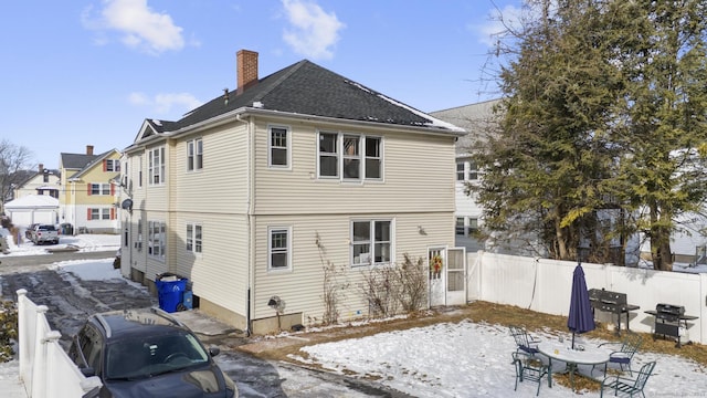 view of snow covered house