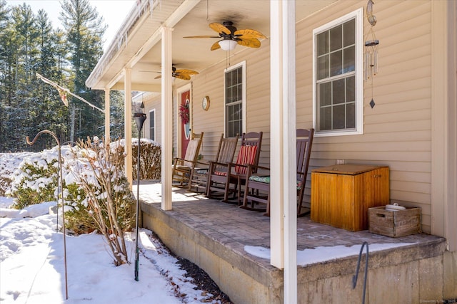 snow covered patio with ceiling fan