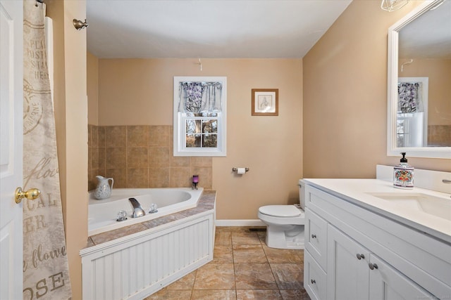 bathroom featuring vanity, toilet, and a bathtub