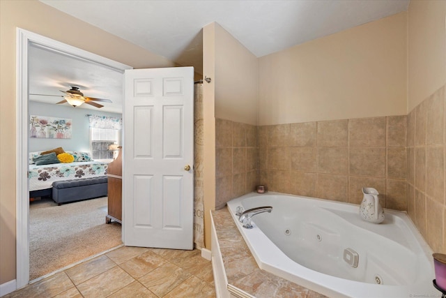 bathroom featuring a relaxing tiled tub, tile patterned flooring, and ceiling fan