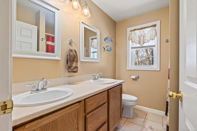 bathroom with vanity, tile patterned floors, and toilet