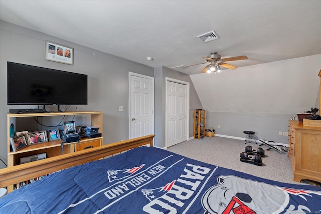 carpeted bedroom featuring lofted ceiling, ceiling fan, and a closet