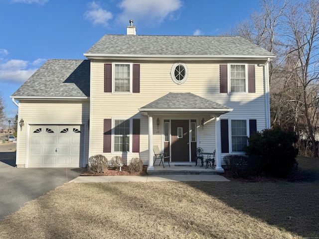 view of front of home with a porch and a garage