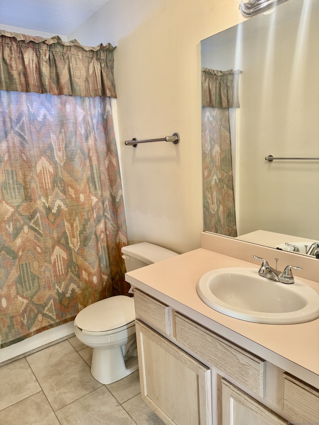 full bathroom with tile patterned flooring, vanity, toilet, and shower / tub combo with curtain