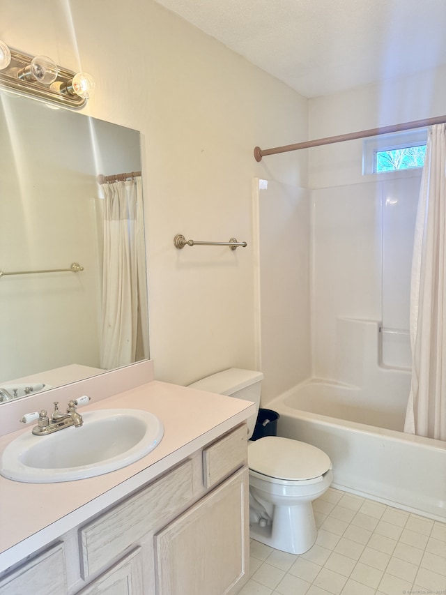 full bathroom featuring vanity, tile patterned floors, toilet, and shower / bath combo